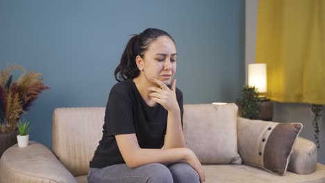 Sad-young-woman-crying-at-home.